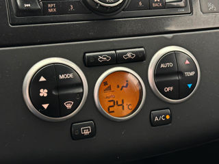 Nissan Tiida фото 10