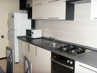 Centru, Petru Movila, apartament cu 2 odai,casa noua, mobilat+ toata tehnica-  500 euro foto 1