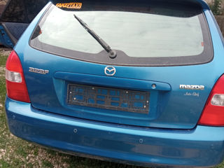 Mazda 323 foto 1