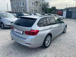 BMW 3 Series Touring foto 3