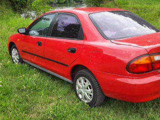 Mazda 323 foto 1