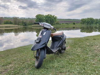 Suzuki AG100 foto 1