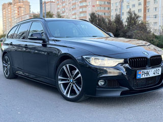 BMW 3 Series Touring foto 3