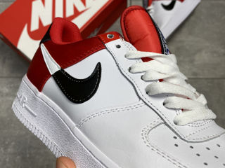 red and white low top forces