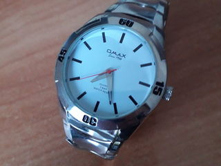 Продам швейцарские часы Omax Quartz 5 bar water resistant since 1946 foto 1