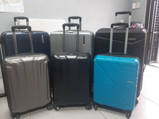 Valize "Samsonite" si "American Tourister"