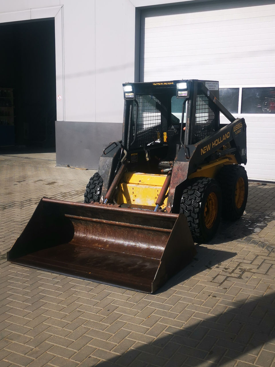 New Holland LX665 foto 1