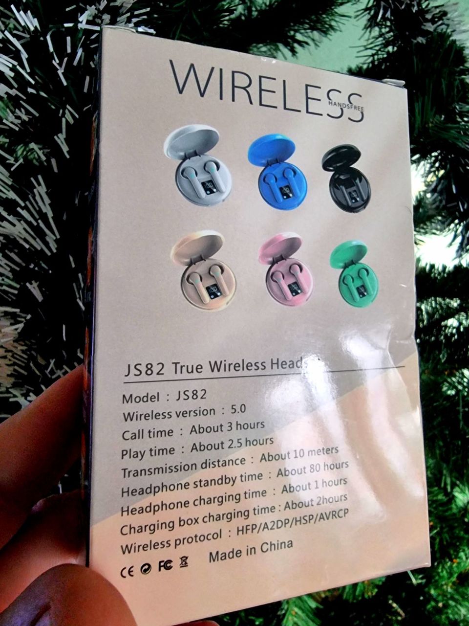 Беспроводные наушники белого цвета.Водонепроницаемые : IPX5