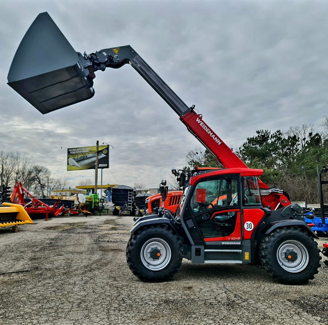 Телескопический погрузчик Weidemann T7042 foto 0