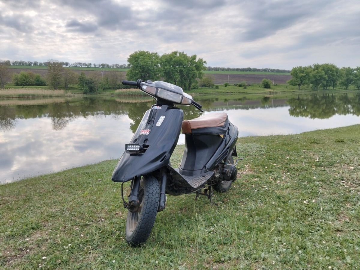 Suzuki AG100 foto 1