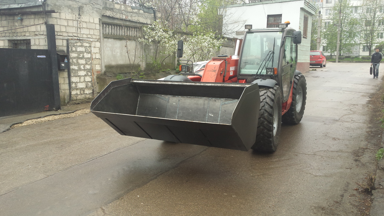 Stivuitor-incarcator telescopic Manitou фото 0