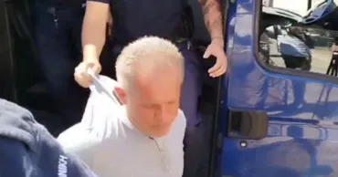 Плахотнюка принудительно доставили в суд в Афинах