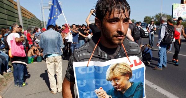 Меркель назвала наплыв мигрантов 