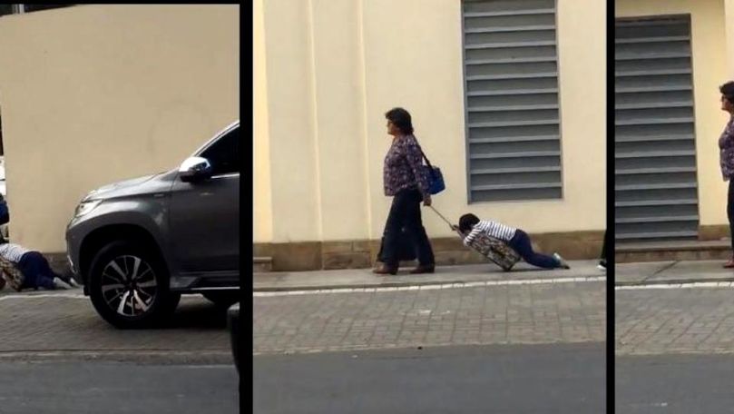 Cum a fost filmată o femeie care își ducea copilul la școală