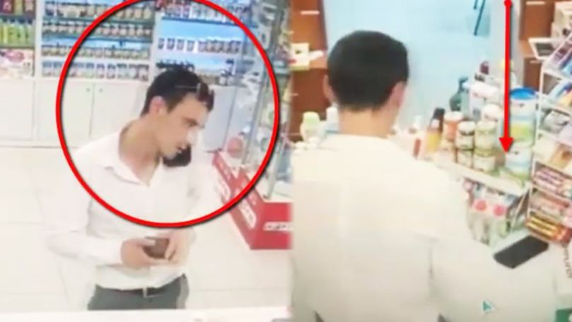 Un tânăr, filmat cum fură un telefon dintr-o farmacie din Capitală