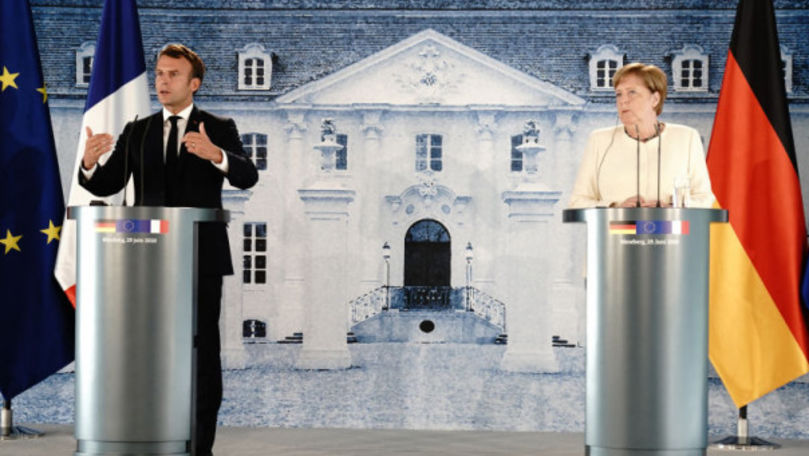 COVID: Macron şi Merkel cer ajutor pentru a face vaccinul accesibil