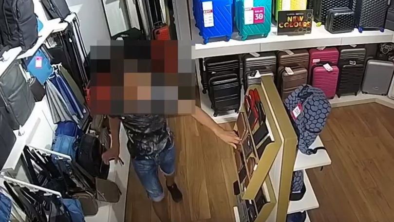 Hoț reținut pe urme fierbinți, filmat cum fură un portmoneu din magazin