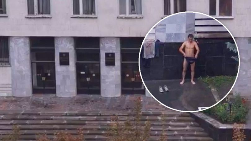 Bărbat gol pușcă, filmat cum face duș sub peretele Procuraturii Generale