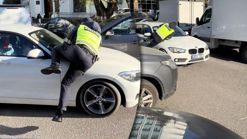 Caz ieșit din comun: Un polițist, luat pe capotă de șoferul unui BMW