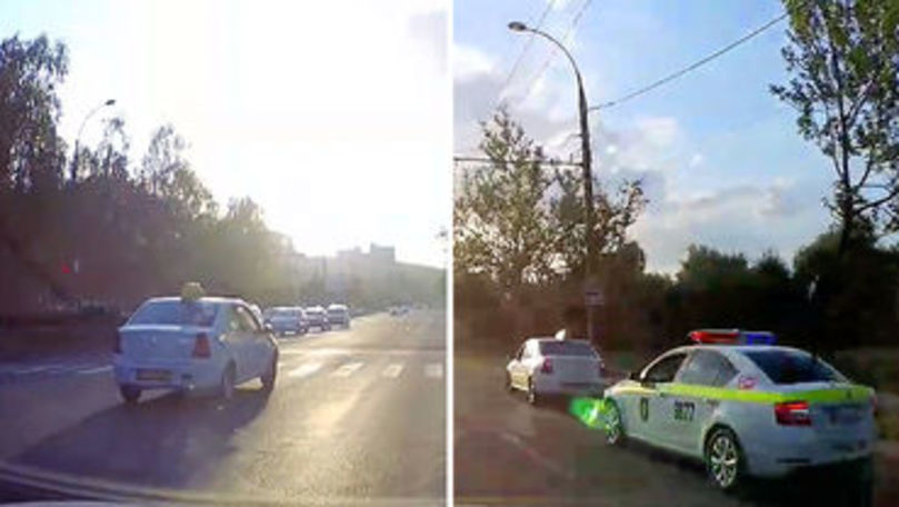 Şofer de taxi filmat cum trece pe roşu chiar sub nasul poliţiştilor
