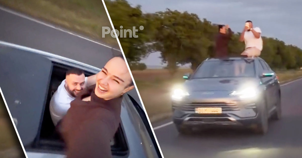 В Молдове водитель и пассажирка BYD высунулись через люк на ходу ради видео.