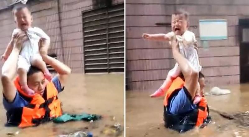 Momentul în care un polițist-erou salvează o fetiță de 2 ani din inundațiile masive care au lovit China. 