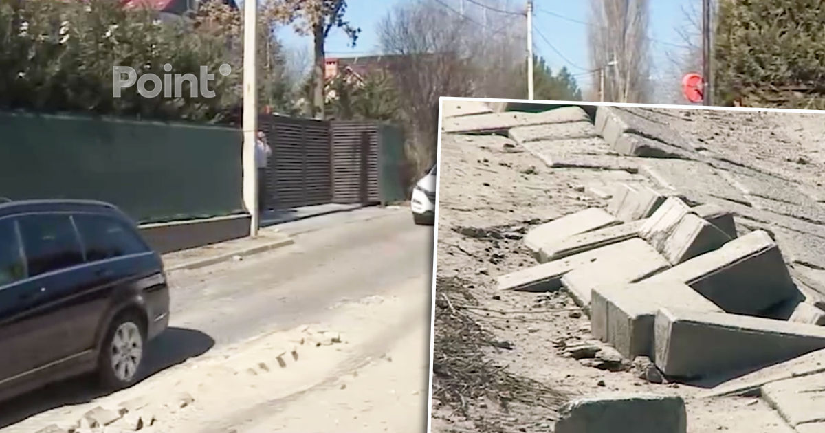 Un drum din Chișinău construit de oameni, distrus de camioane.