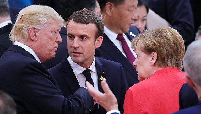 Президент Соединенных Штатов Америки Дональд Трамп, канцлер Германии Ангела Меркель и президент Франции Эммануэль Макрон.