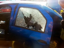 Одна из трех выпущенных по автомобилю пуль попала в заднюю левую дверь. Фото: Facebook
