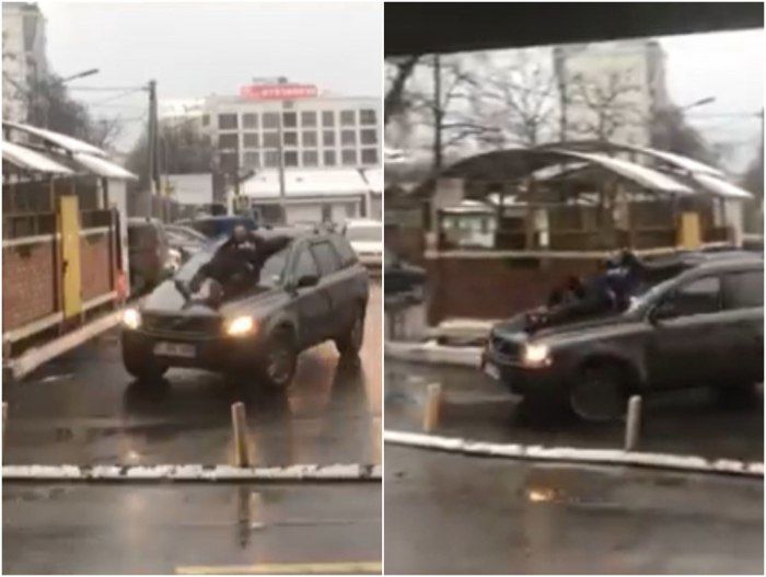 Мужчина на капоте движущегося автомобиля был замечен на одной из столичных улиц.