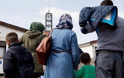 В Германии приняли спорный закон о воссоединении семей беженцев.
