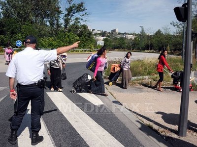 Evacuarea taberelor de romi continuă în Franţa (Imagine: Mediafax Foto/AFP)
