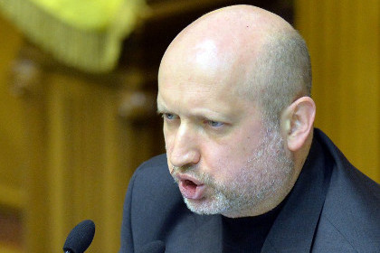 Турчинов обвинил Россию в провокации военного конфликта с целью последующей аннексии территорий. Фото: Сергей Супинский / AFP