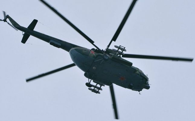 Un elicopter al armatei ruse echipat, surprins în luptele din Siria