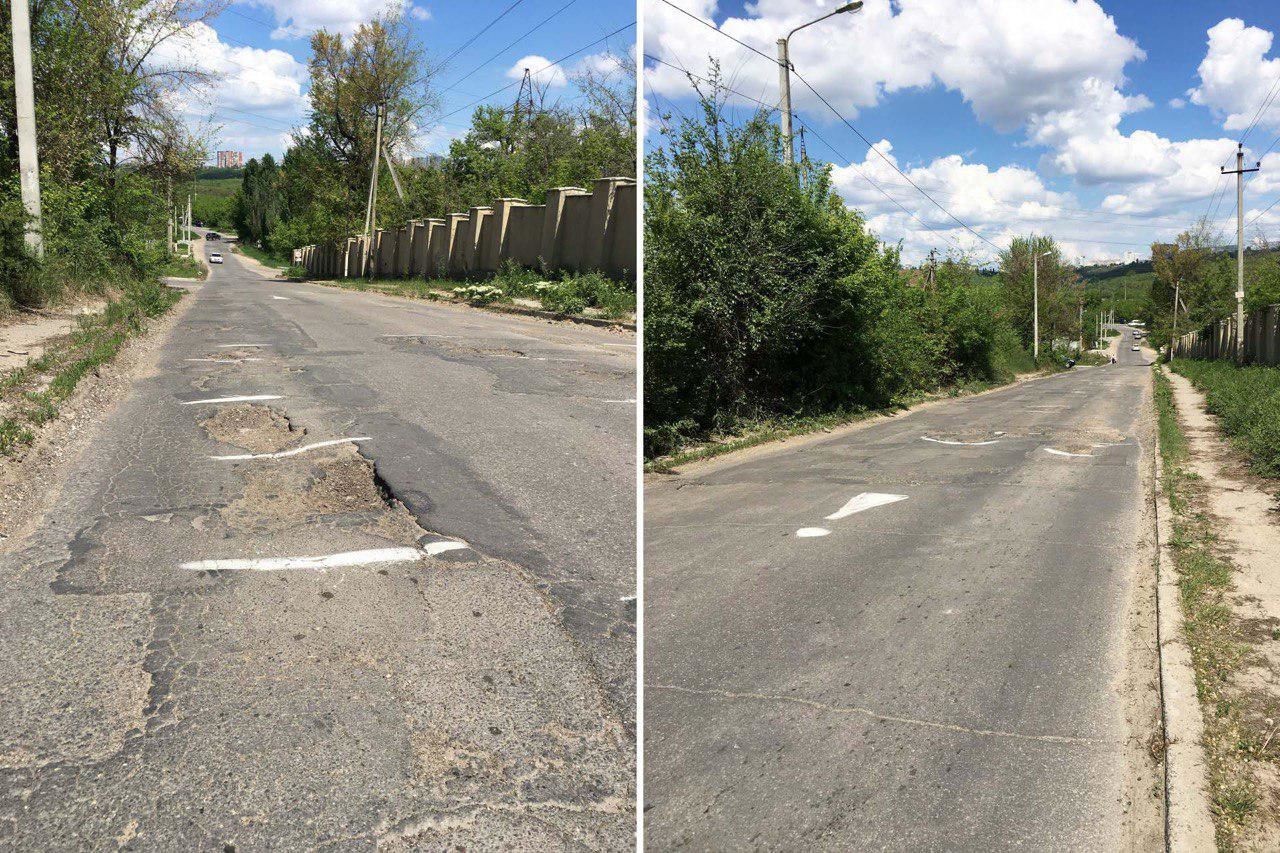 Жители столичной улицы краской обводят ямы на дороге.