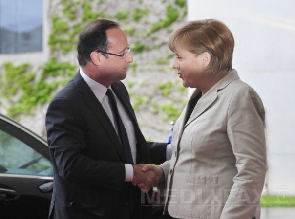 Francois Hollande şi Angela Merkel condamnă atacurile preşedintelui turc la adresa ţărilor lor. Foto: AFP/ Mediafax 