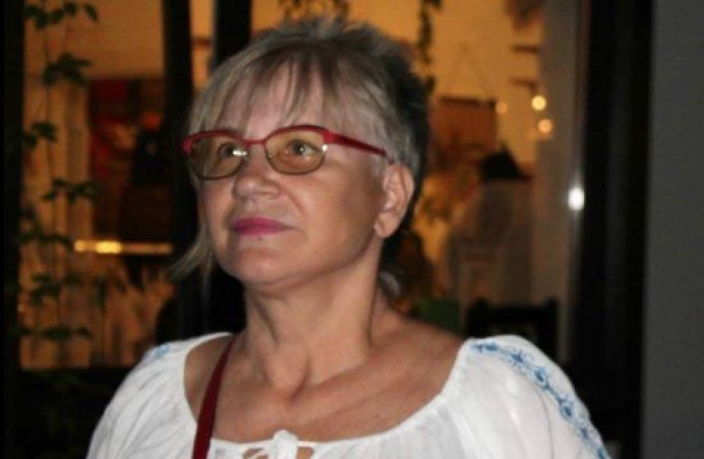 Jurnalista şi scriitoarea Olga Capăţînă.