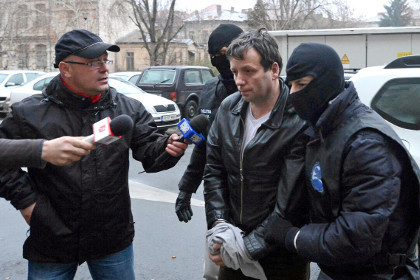 Хакер, арестованный румынскими властями. Фото: Silviu Matei / Mediafax / Reuters