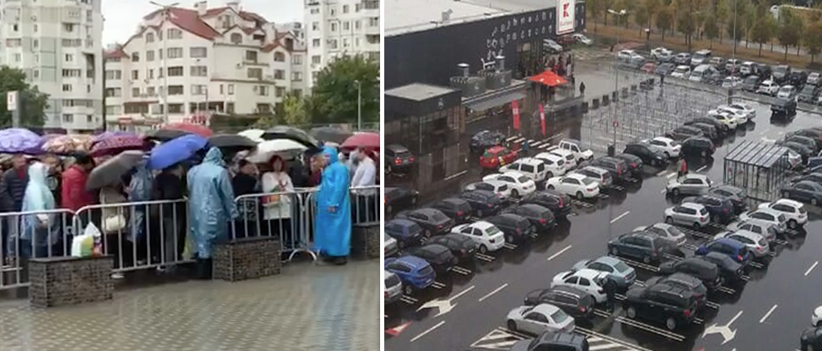 Люди стоят в очереди под дождем, чтобы попасть в Kaufland.