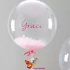 Balon transparent cu pene pline cu heliu
